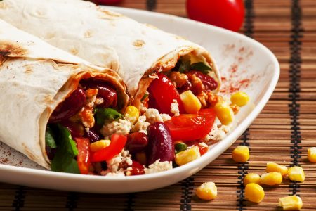 Traditional Mexican food, burritos with meat and beans, selective focus